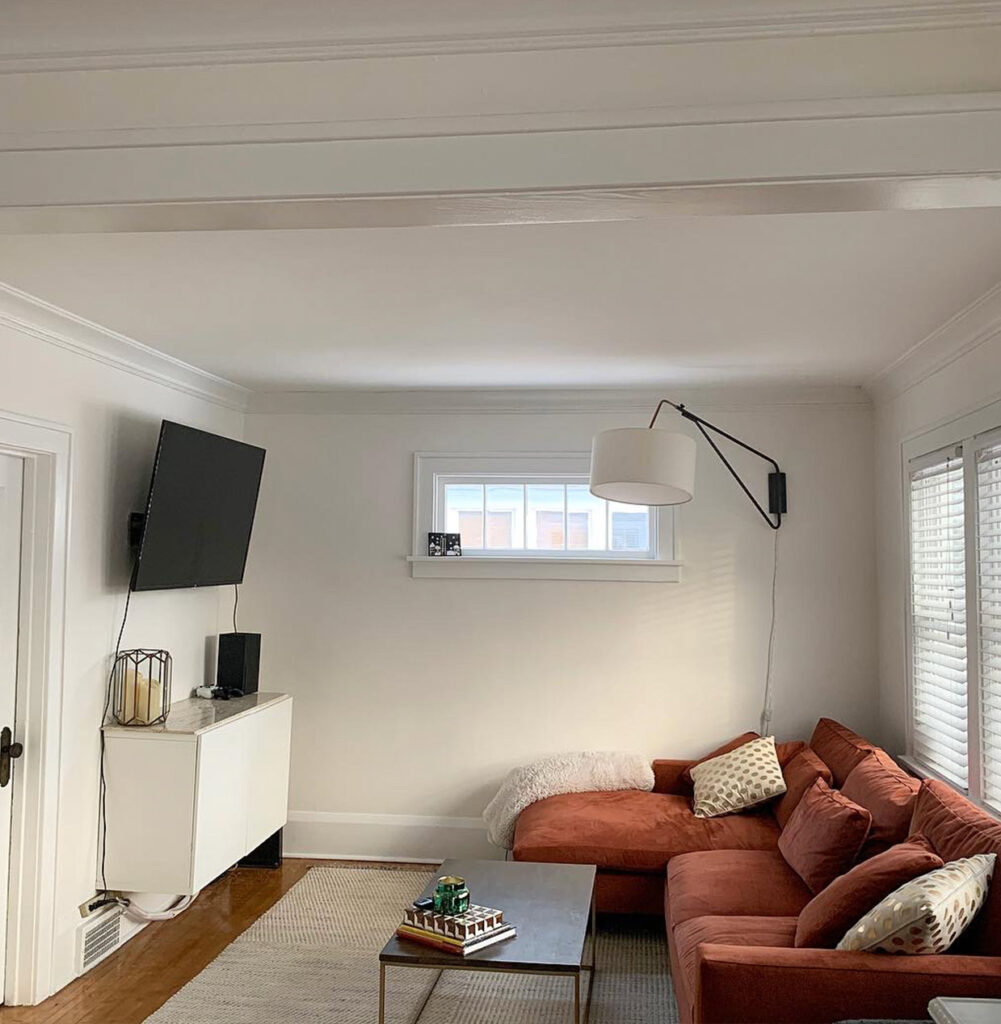 white living room with brown couch