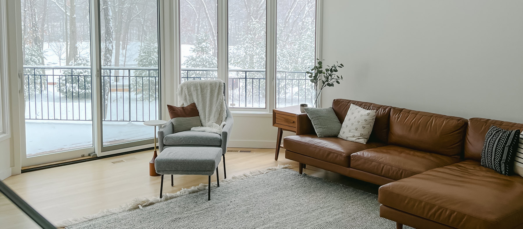 leather couch in white living room