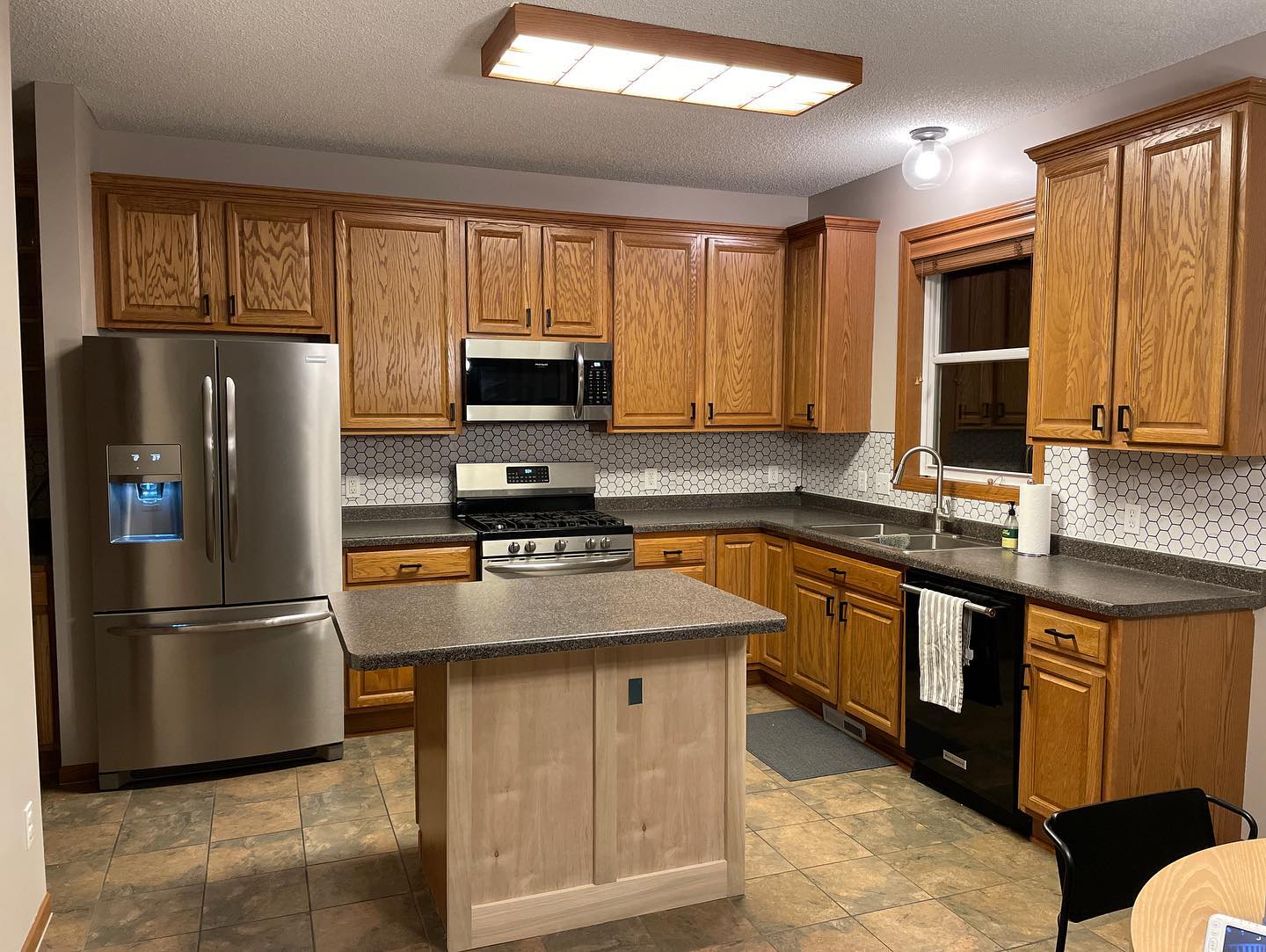 Wood kitchen with stainless steel appliances