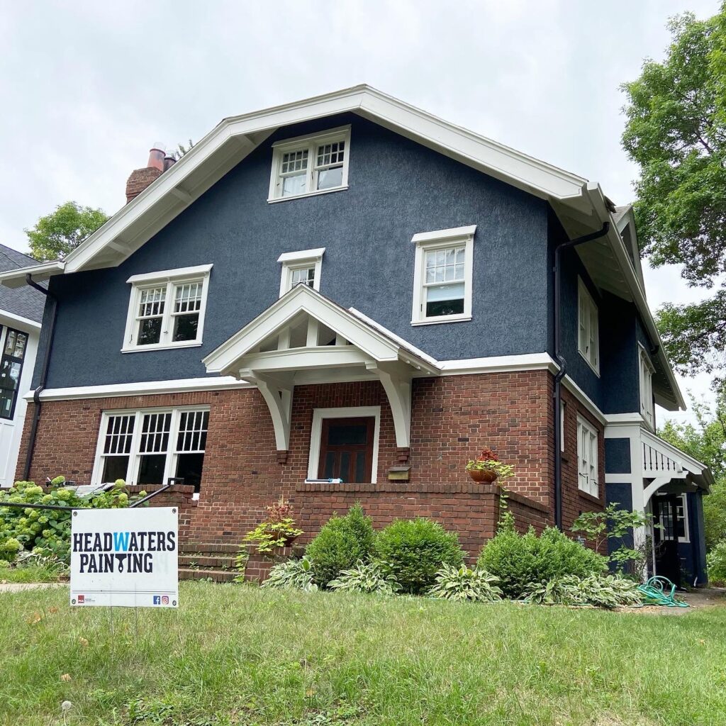 Blue stucco and brick home in Minneapolis